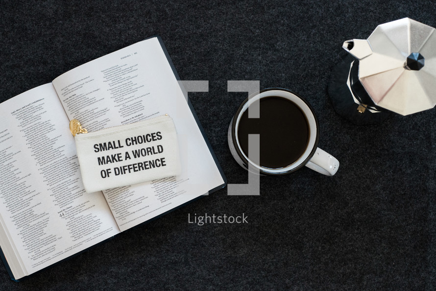small choices make a world of difference coin purse on a Bible 