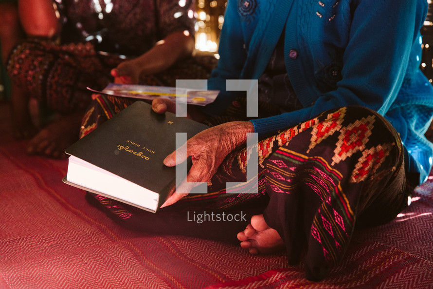 woman holding a Bible in Myanmar