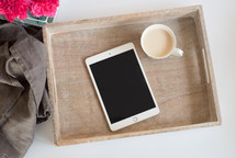 iPad and coffee cup in a wood tray 