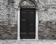door and entrance to a brick building 