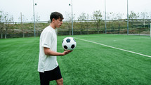 Teenager Does Freestyle Soccer Dribbles In The Field