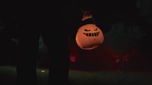 Zombi walking with halloween pumpkin