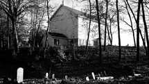 old church and cemetery in black and white 