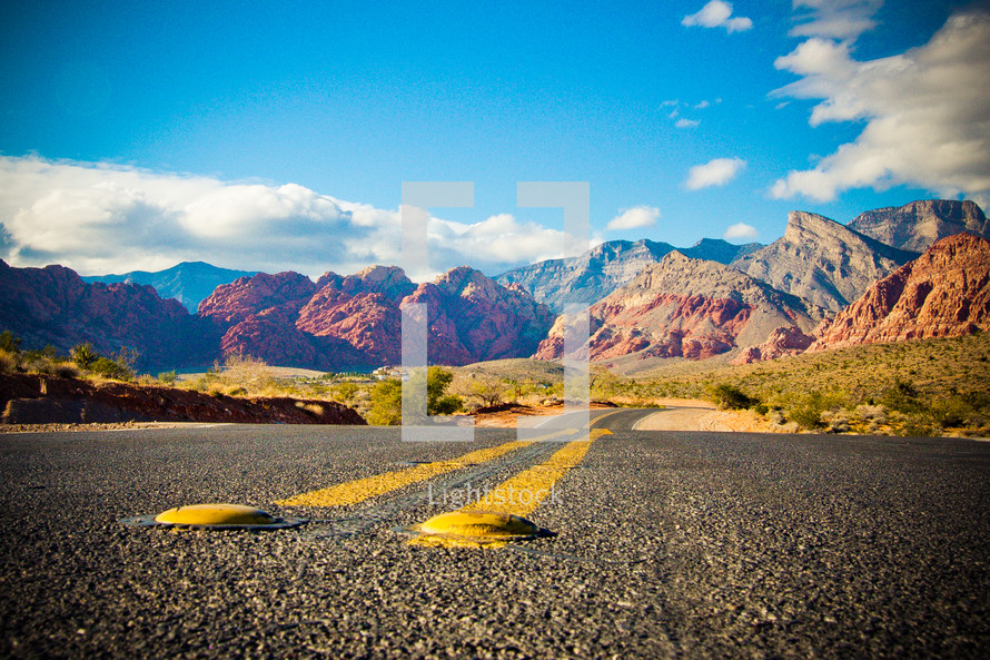 open road through the Nevada desert mountains