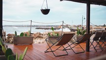 Sea view terrace with deck chairs