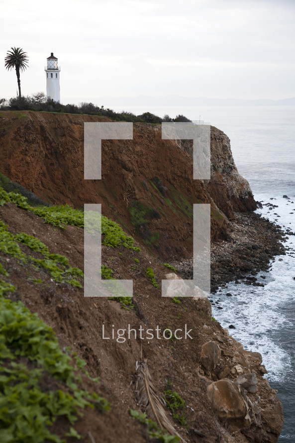 lighthouse and sea cliffs 