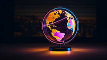 Neon world globe on a desk. 