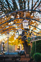 lanterns hanging over picnic tables 