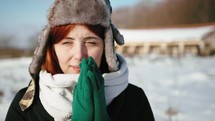girl with gloves feeling cold 