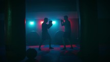 Silhouette of man training boxe sport exercises in gym  for health
