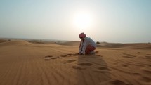 Woman Touching The Beauty Of Desert With Her Hands 