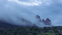 Timelapse of morning fog over towering sandstone buttes