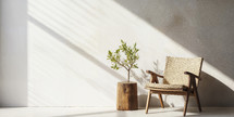 Stylish modern chair with organic wooden side table against a warm, sunlit wall.