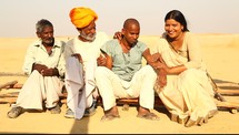 family sitting together talking in India 