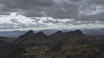 Timelapse of clouds over rugged peaks in the desert