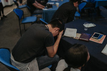 praying classroom of students at a Bible study 