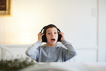 excited boy with headphones 