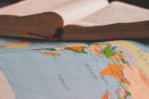 open Bible on a map 