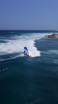 Wind Surfer is surfing on the waves. 27 August 2023. Baja California Sur, Mexico.