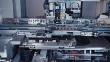 Automated SMT machine placing electronic components on a board