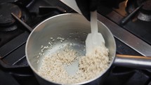 Mixing rice for a risotto meal 