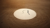 A woman standing in side a circle in the dirt. Inner circle concept. 