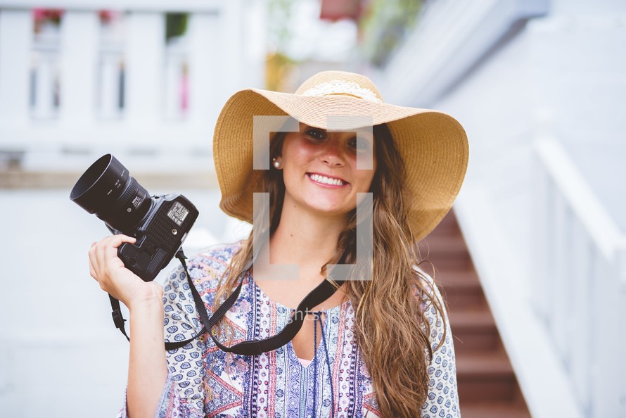 a woman holding a camera 