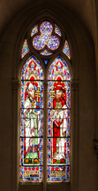 stained glass window from a french church, featuring two biblical figures