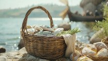A picturesque basket filled with fresh fish and bread by the sea, evoking the miracle of the loaves and fishes.
