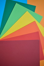 a rainbow of colored paper 