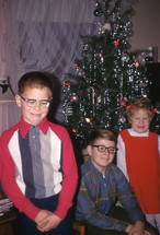 children in front of a vintage Christmas tree 