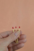 a person holding matches in their hands 
