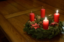 two candles burning on an advent wreath for the second advent. 
advent, candle, Christmas, candles, four, three, two, one, lit, light, bright, burn, burning, wreath, birth, Jesus, born, waiting, wait, flame, flames, red, arrive, arriving, come, coming, await, await arrival, arrival, anticipated, anticipate, anticipating, expected, expect, expecting, awaited, long-awaited, hope, hoping, desiderated, longed, longed for, long-yearned-for, crave, desire, long, desiderate, longing, craving, desiring, fir, fir branch, branch, fir-bough, cone, fir cone, pine, pine cone, quiet, time, Christmas story, nativity, nativity story, countdown, count, second, second advent