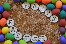 HAPPY EASTER burned into pieces of wood surrounded with colorful eggs on straw. 
Happy Easter, wood, piece, pieces, letter, letters, burned, written, write, writing, happy, easter, frame, egg, eggs, color, multicolored, colorful, eggshell, blown out, paint, painted, straw, spring, colored, symbol, decoration, green, red, yellow, orange, purple, blue, lilac, white, shell, egg shell, decorate, deco, decorating, tree, tree pit, round, circle, wooden, desk, grain, texture, vein, Easter egg, easter eggs, natural, burn, brand, pyrography, characters, word, words, greeting