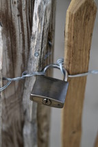Padlock on a wooden fence. 