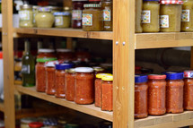 jars of preserved food on pantry shelfs