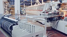 Machines working in a furniture manufacturing facility