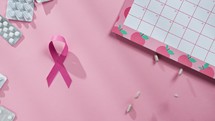 Pink Ribbon And Pills On Table