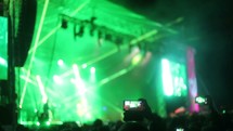 musicians on stage and stage lights at a concert 