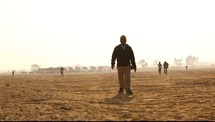 men walking in a desert 