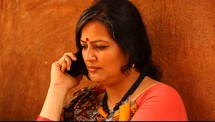 woman in India talking on a cellphone 