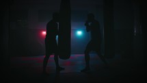 Silhouette of man training boxe sport exercises in gym  for health