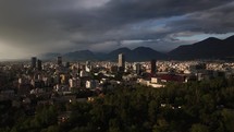 Tirana skyline Albania aerial view at sunset with scenic mountains and clouds in the background