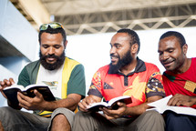 men reading Bibles 