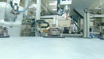 Advanced robotic machine manufacturing parts in an automated assembly line