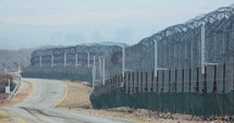 Border of Syria and Israel. Tall fences with military posts and UN soldiers