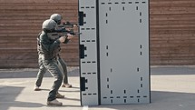 Slow motion of soldiers training in close quarters combat