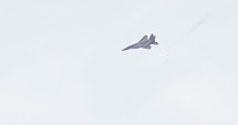 F-15 fighter jet maneuvering during an airshow