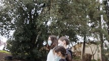Coronavirus pandemic - kids walking outdoors with face masks to avoid contagion