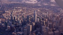 flying over downtown San Francisco by plane at golden hour